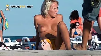 Play This girl nudist strips bare at a public beach