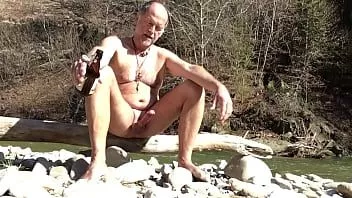 Play Nudist daddy playing with his dick in the great outdoors